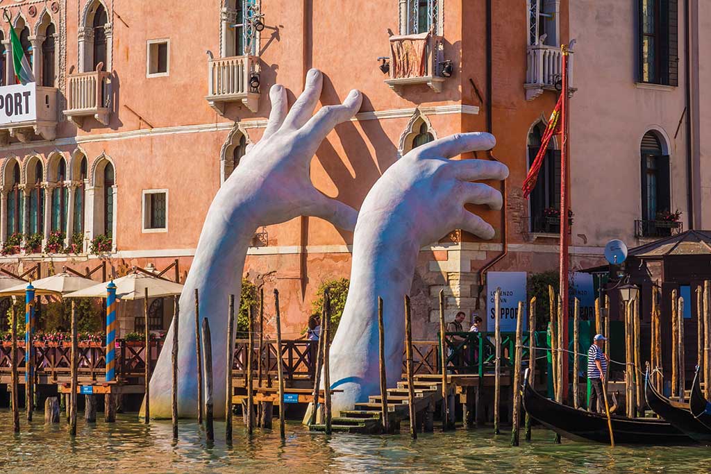 Sculpture by Lorenzo Quinn for the Venice Bienale Highlights Climate Change