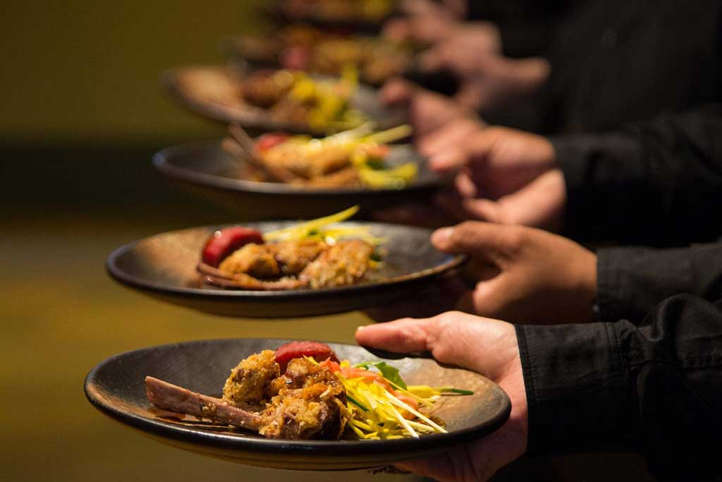 Servers at the ready with crispy lamb chops