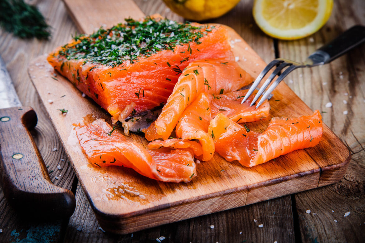 Homemade,Smoked,Salmon,With,Dill,On,A,Wooden,Table Gravlax (Photo by NBLX)